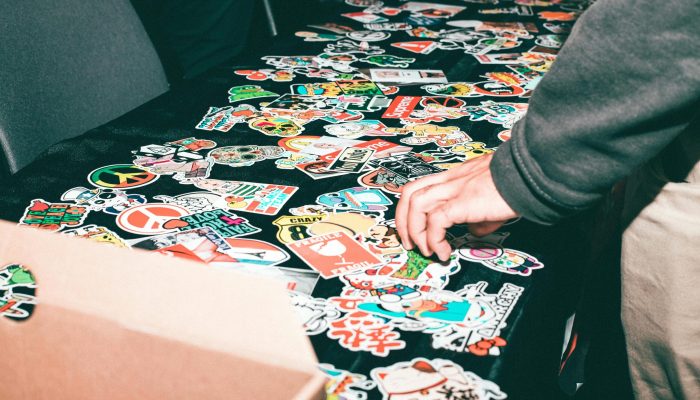 Vibrant assortment of stickers displayed on a table indoors.